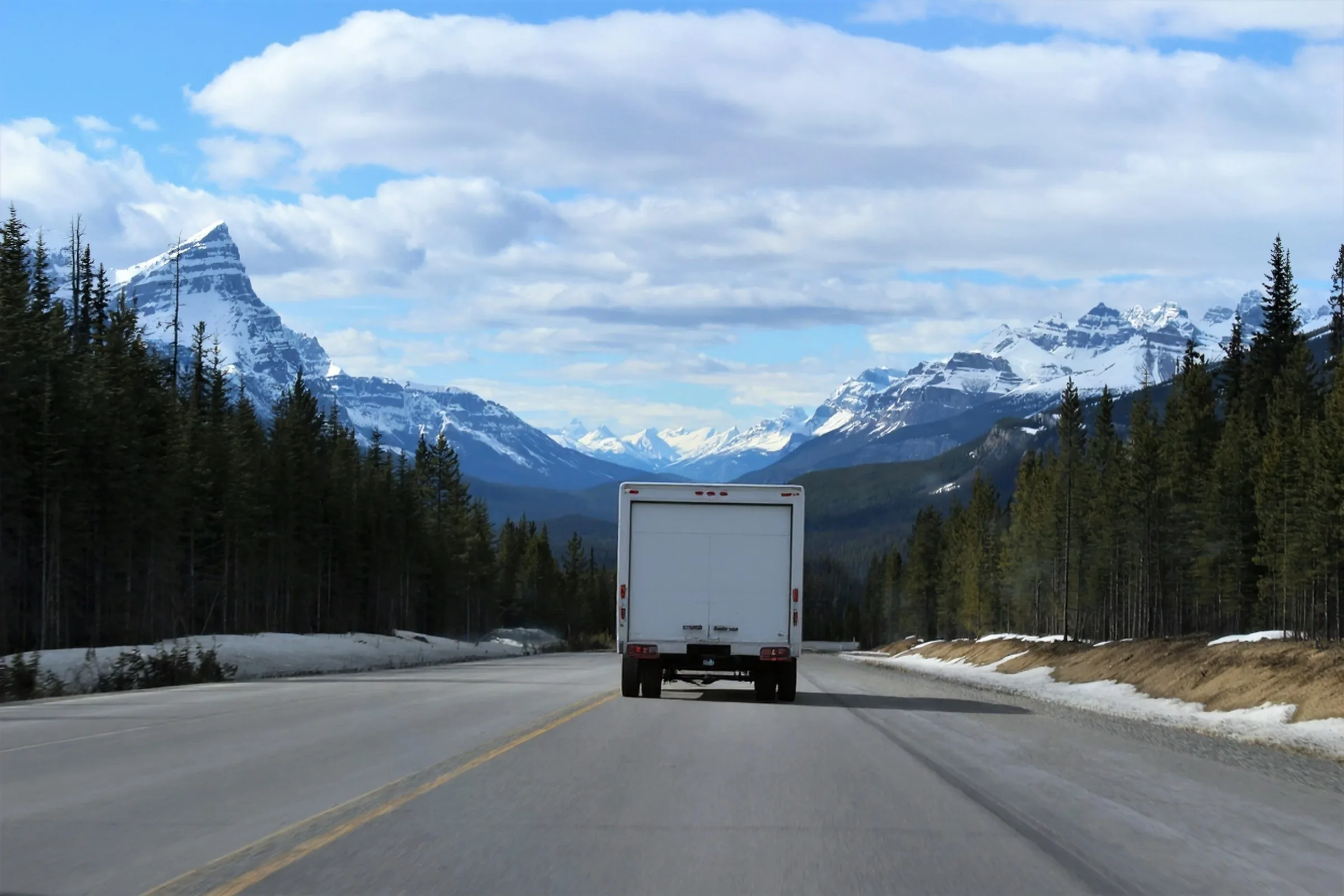 Moving truck driving through the Colorado Rockies